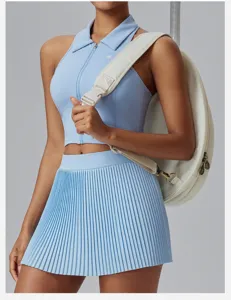 Women's athletic tennis set sleeveless crop top pleated skirt with round sports bag.