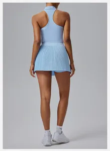 Women light blue sleeveless tennis top and pleated skort activewear set for fitness sports.