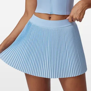 Light blue pleated tennis skort with high waist design, quick-dry fabric for sports and fitness.