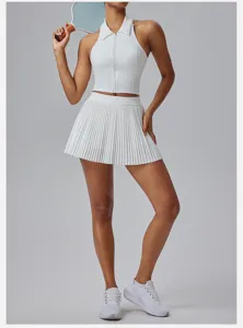 White athletic zip polo crop top and pleated tennis skirt set for women, activewear.