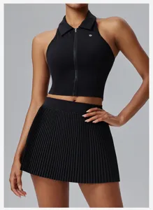 Detailed view of the black pleated tennis skirt and zipped top, featuring quick-dry fabric.