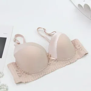 Detailed view of women's nude lace push-up bra showcasing fine lace trim and smooth cups.