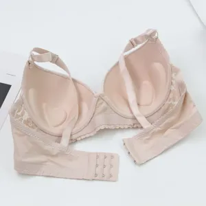 Seamless push-up bra detail showing heart-shaped molded cups and elegant lace wings.