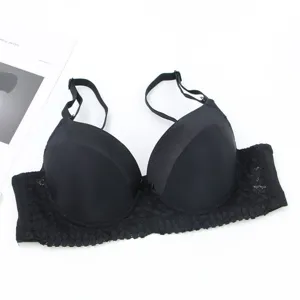 Black push-up bra for women featuring smooth molded cups and delicate lace trim details.