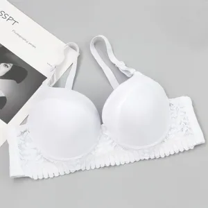 Close up view of the white push-up bra featuring smooth cups and delicate lace trim details.