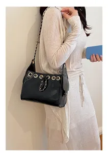 Chic quilted chain bucket bag with drawstring design, stylish commuter underarm bag for women.