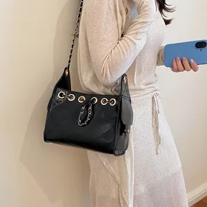 Chic black quilted chain bucket bag for women, elegant shoulder bag with stylish drawstring.