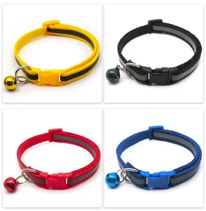 Reflective pet collar detail view, showcasing nylon strap, quick-release buckle, and bell.