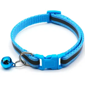 Detailed view of blue reflective pet cat dog collar with bell and adjustable buckle.