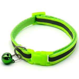 Close-up detail of the bright green reflective pet collar featuring safety buckle and bell.