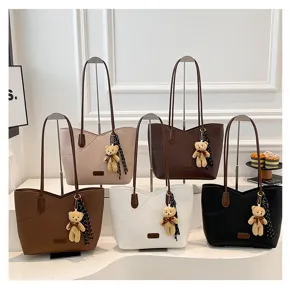 Classic solid color large capacity tote bag with cute bear pendant, stylish commuter shoulder bag.