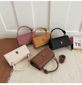 Vintage woven leather baguette handbag with knot handle, stylish shoulder bag for women