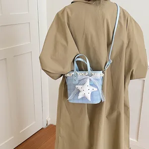 Light blue plaid bucket bag featuring delicate lace trim and a cute plush star pendant.