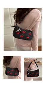 Retro denim shoulder bag with red cherry embroidery and cute metal pendant for women casual.