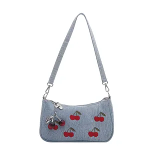 Denim shoulder bag for women, featuring cute embroidered cherry patterns and metal pendant.