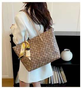 Detailed view of the stylish large capacity women tote bag with monogram pattern and chic scarf.