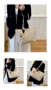 Stylish women's tote bag with classic monogram pattern and elegant scarf accessory.