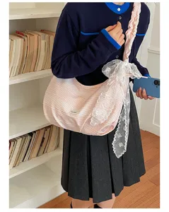 Casual pink striped canvas shoulder bag with lace bow, stylish underarm bag for women.