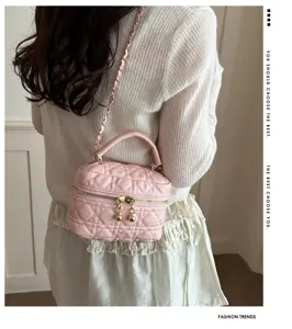 Pink quilted mini vanity shoulder bag detail, stylish chain strap and elegant hardware.