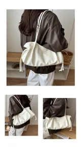 Details of the white pleated shoulder bag, soft PU leather large capacity underarm handbag.