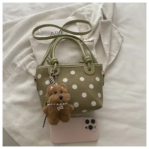 Retro green polka dot bucket bag with cute bear pendant, stylish women leather shoulder bag.