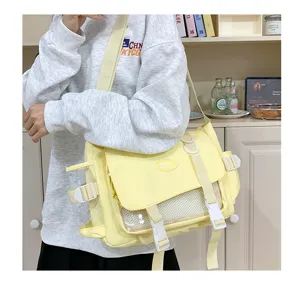 Cute Japanese college style canvas messenger bag with clear ita window and large capacity.