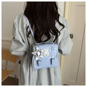 Cute blue polka dot mini backpack with bunny patch and star pendant for casual daily wear.