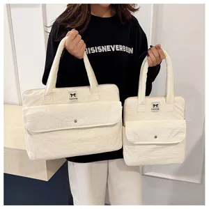 Gesteppte Laptoptasche Handtasche mit Griffen und Fronttasche für stilvolle Nutzung.