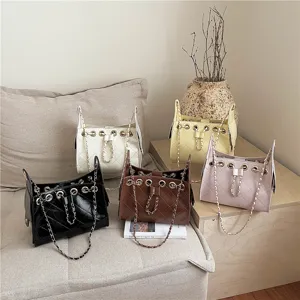 Quilted chain bucket bag with metal eyelets and drawstring design, perfect daily shoulder bag.