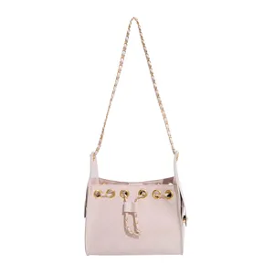 Pink quilted bucket bag with gold chain strap and stylish drawstring design for women.