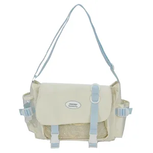 Casual canvas messenger bag with adjustable strap and front mesh pocket for daily student use