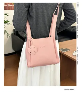 Pink lychee pattern bucket bag for women, stylish shoulder crossbody bag for daily commute.