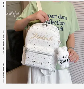 Stylish white star print women backpack with cute bunny plush charm for casual daily use.