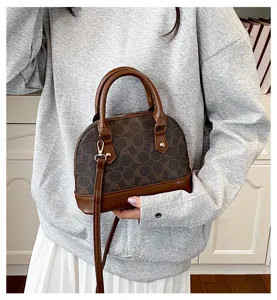 Brown vintage monogram dome shoulder bag, stylish casual crossbody purse with top handle.