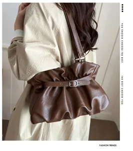 Brown ruched shoulder bag for women, stylish PU leather tote bag with metal buckle strap.