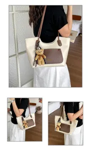 Close-up detail of the stylish PU leather shoulder tote bag featuring a cute bear plush pendant.
