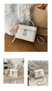 Chic quilted crossbody bag for women with plush bear charm and chain strap style.