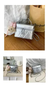 Silver quilted vanity crossbody bag with cute plush bear pendant, trendy shoulder handbag for women.