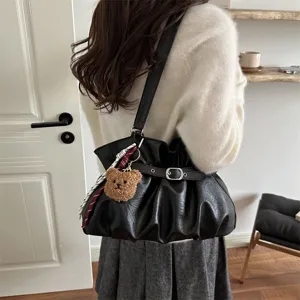 Black ruched shoulder bag for women, commuter daily tote with cute bear pendant and ribbon.