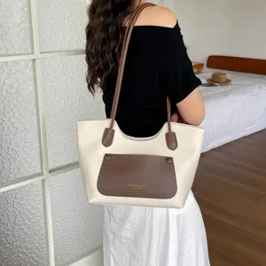 Detailed view of women casual large capacity shoulder tote bag in off-white and brown.