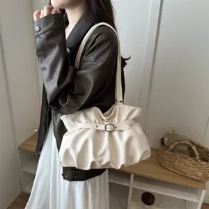 Cream ruched shoulder bag detail, soft PU leather texture, chic buckle strap, stylish bag.