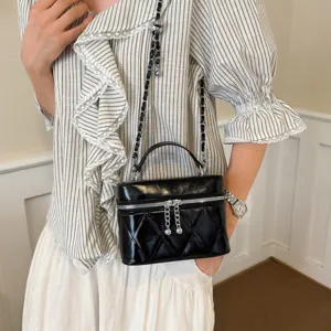 Chic black quilted box handbag with metal chain strap and top handle for women daily commute use.