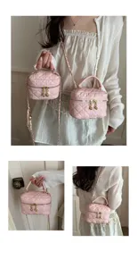 Close-up details of the pink quilted mini shoulder bag with elegant chain and chic design.