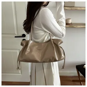 Stylish glossy pleated shoulder bag for women, featuring a chic drawstring hobo design.