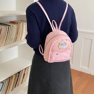 Cute pink mini backpack with cat face embroidery and star print, perfect for daily casual style.