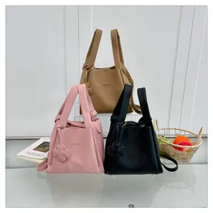 Stylish litchi pattern bucket bag with handbag strap, elegant daily casual shoulder bag style.