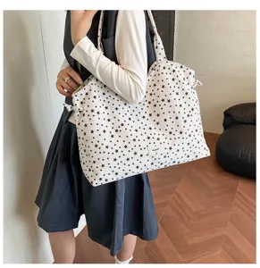 Close-up detail of the Korean style star print canvas tote bag with drawstring sides and shoulder.