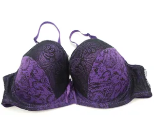 Close-up detail of a purple and black lace push-up bra with delicate floral patterns and straps.