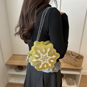 Stylish gold glitter snowflake shoulder bag with silver chain strap for women detail view