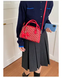 Stylish red bowling shoulder bag with geometric pattern, trendy crossbody handbag.